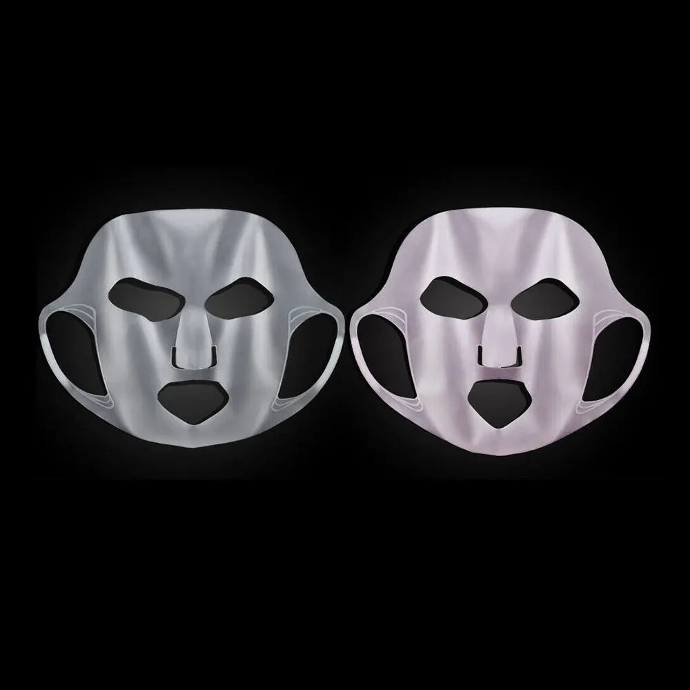Two silver face masks on a black background