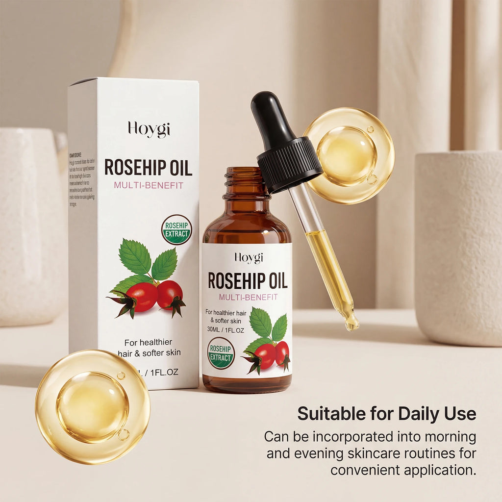 Hoygi Rosehip Oil Multi-Benefit bottle and box shown on a warm beige background with decorative ceramic vases and floating gold oil droplets. The amber glass bottle has a black dropper cap and a white label with rosehip illustrations.