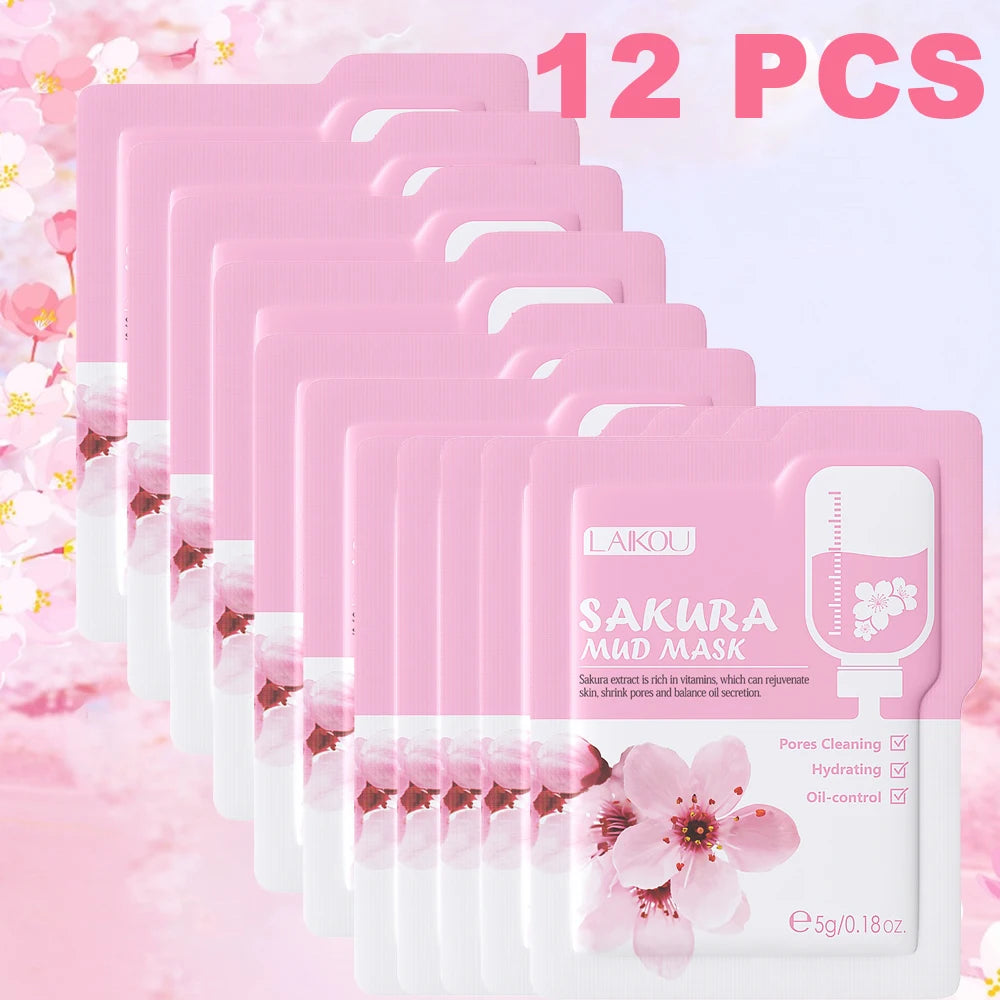 Pack of 12 Sakura Mud Mask packages with cherry blossom design on a pink floral background