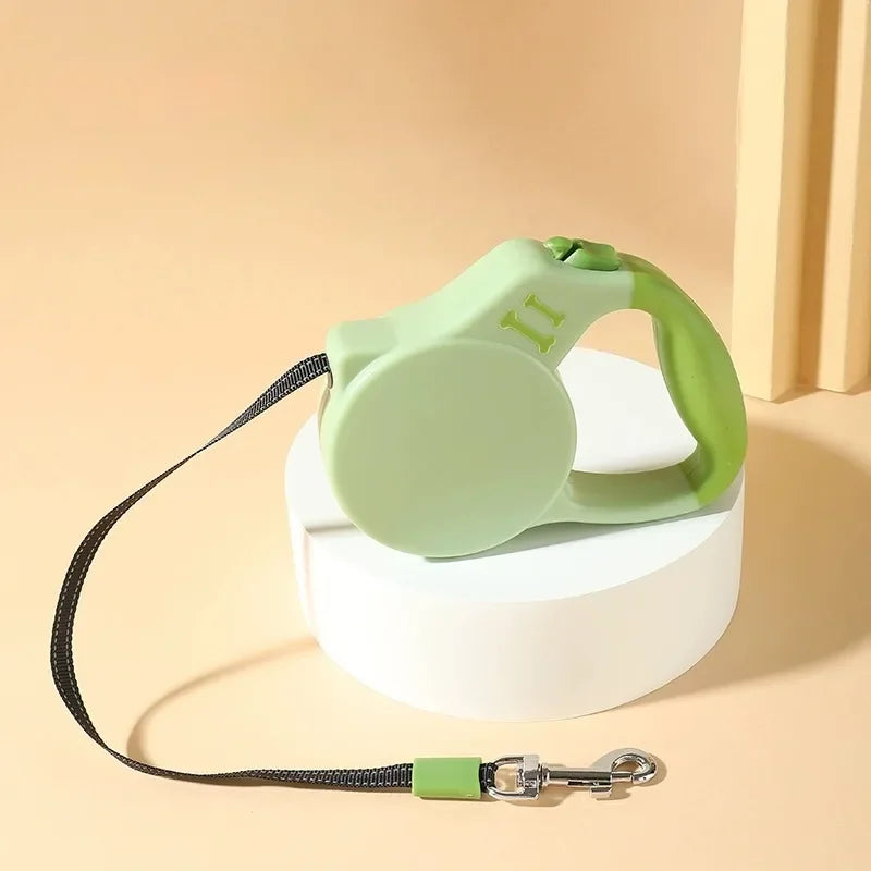Green retractable dog leash on a beige background
