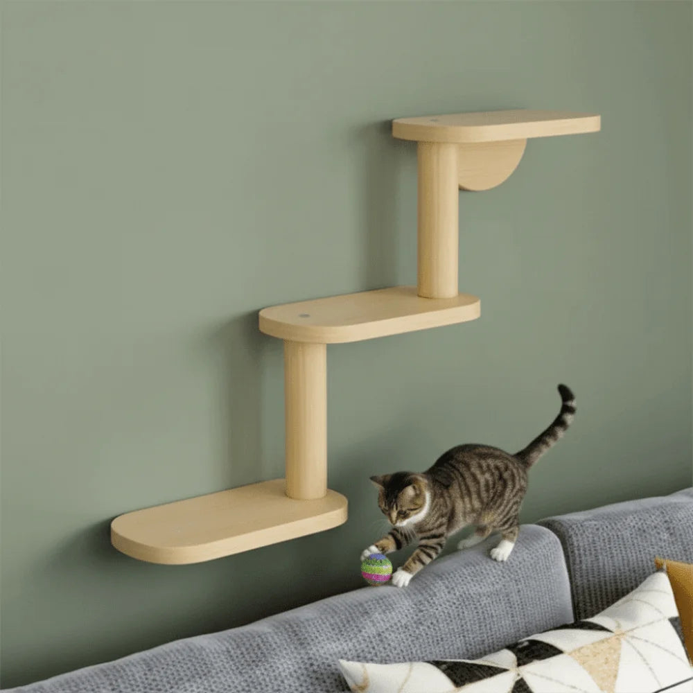 Wooden wall-mounted cat shelf with a cat playing on a sofa against a green wall.