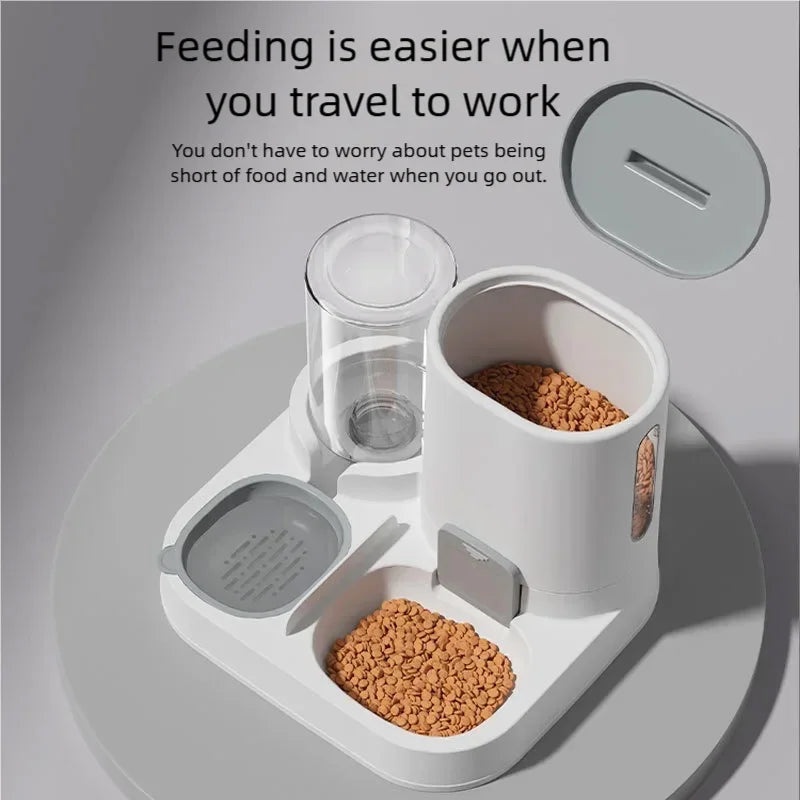 A white and gray automatic pet feeder with two bowls of kibble, a clear water cup, and a lid shown separately on a light gray background with promotional text.