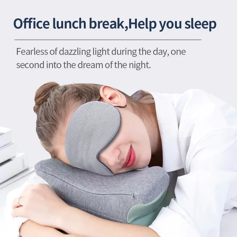 Person using a travel pillow and eye mask with text about office sleep aid.