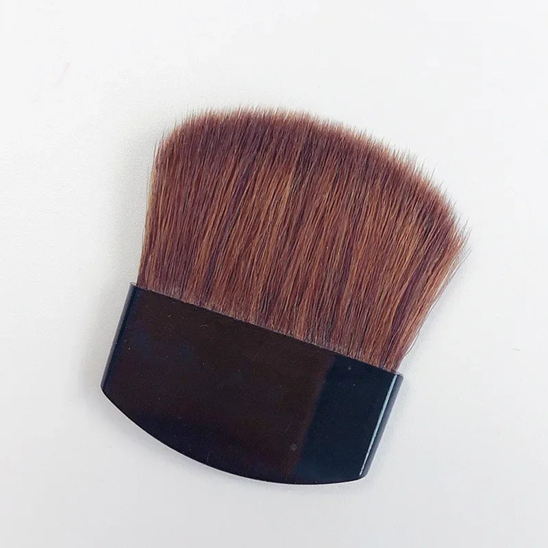 Makeup brush with brown bristles on a white background