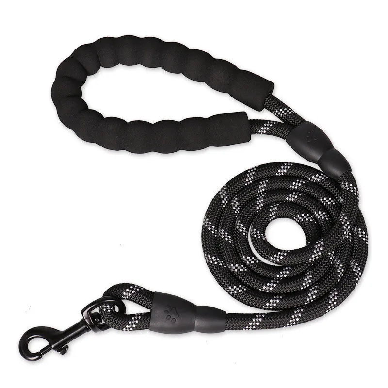 Black dog leash with textured handle and metal clip on a white background