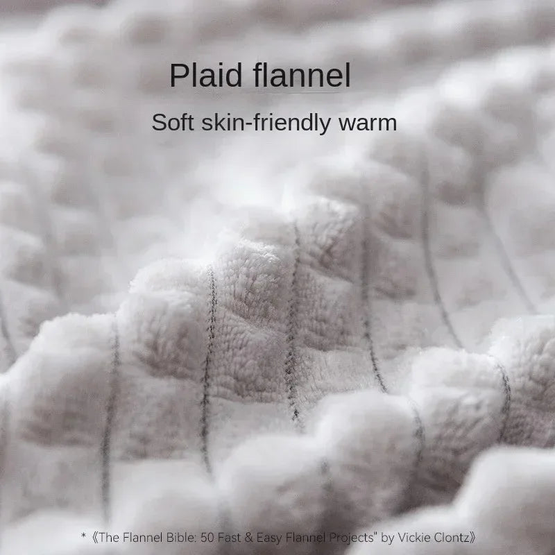 Close-up of plaid flannel fabric with text describing its softness and warmth.