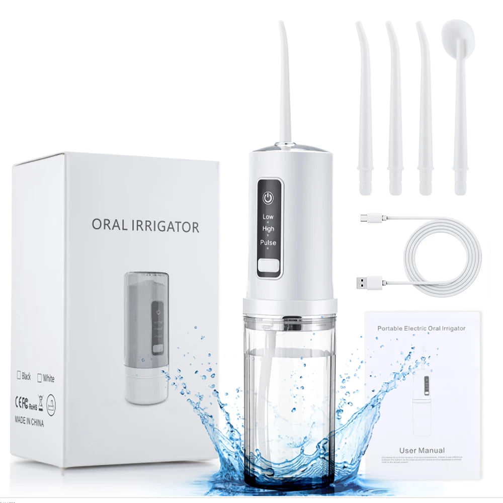 White oral irrigator with packaging, USB cable, and user manual on a white background
