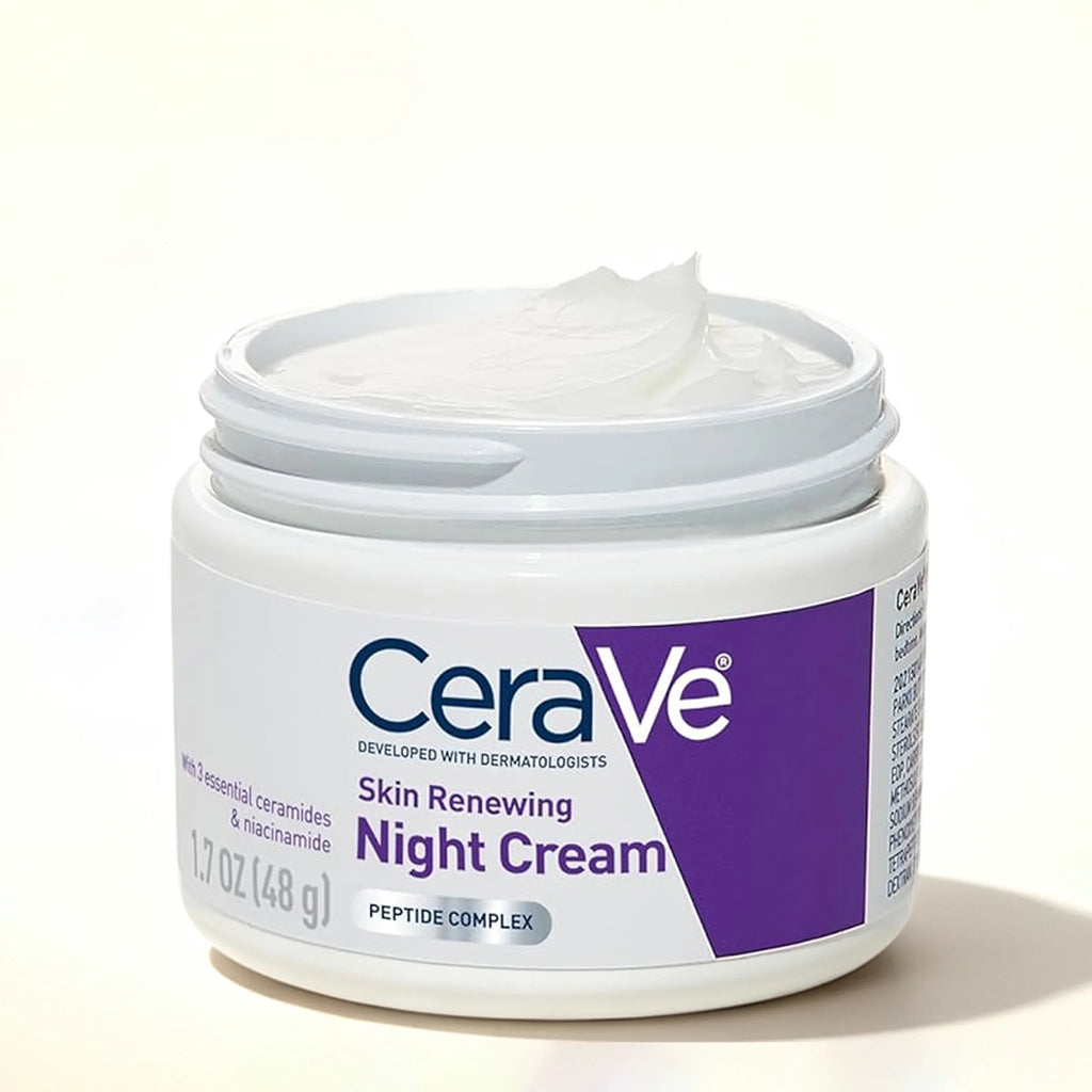 An open white jar of CeraVe Skin Renewing Night Cream, showing the white cream inside, on a clean white background.