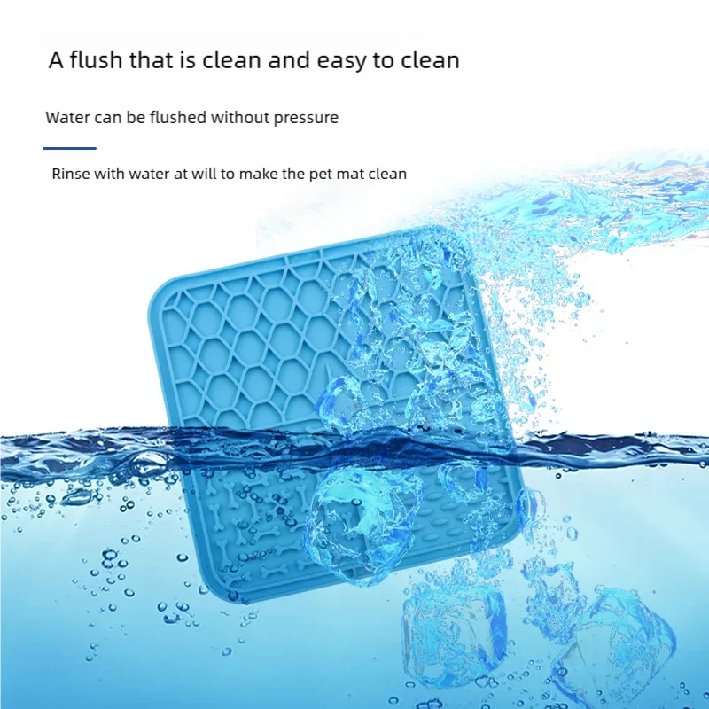 Blue pet mat being rinsed with water, surrounded by splashes on a light blue background.