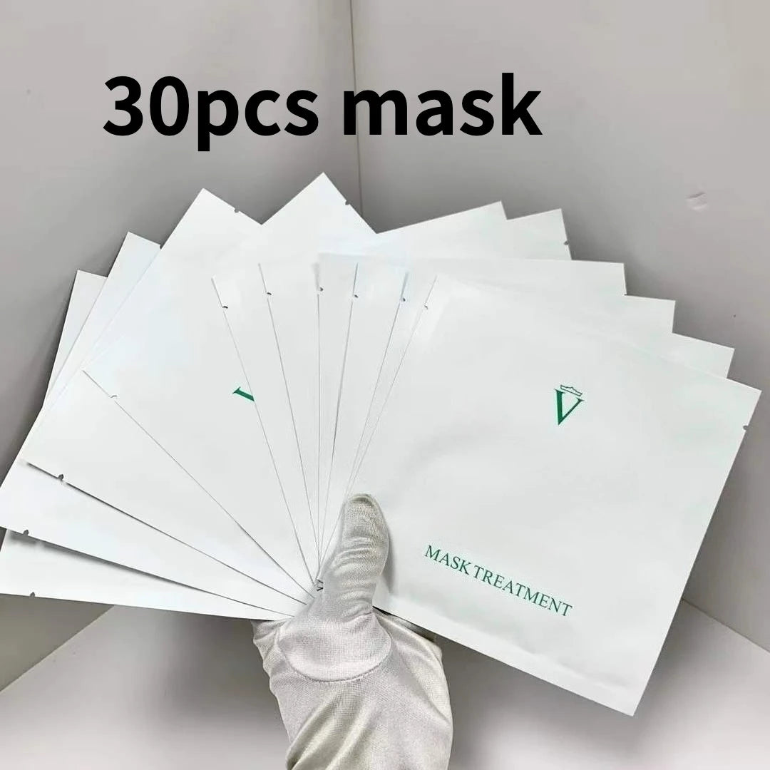 30-pack of face masks with a gloved hand holding one, on a neutral background.