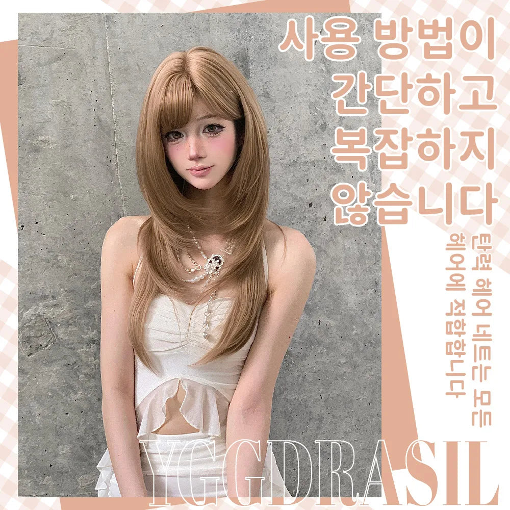 A woman modeling a long, straight, light brown wig with bangs, wearing a white top against a textured gray concrete wall. Korean text overlays are present on the right side, and a stylized watermark is at the bottom.