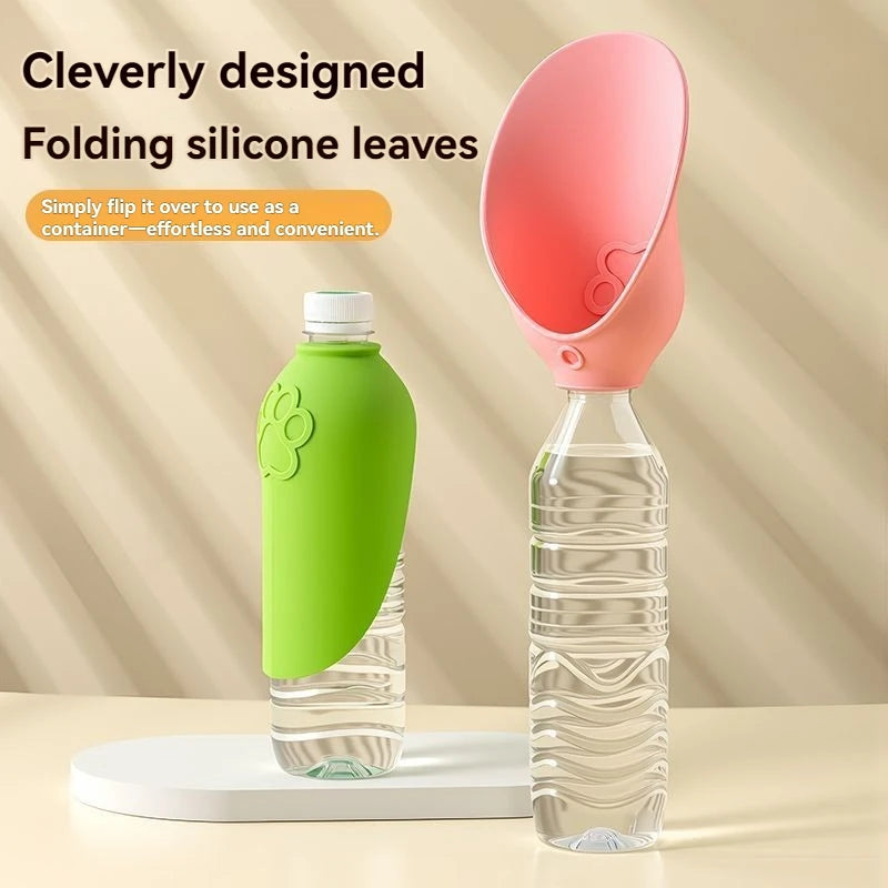 A folding silicone water bottle lid shown in two states: closed with a bright green silicone sleeve on a clear plastic bottle, and open with a pink silicone funnel-shaped lid attached to the same bottle. The image includes promotional text on a beige background.