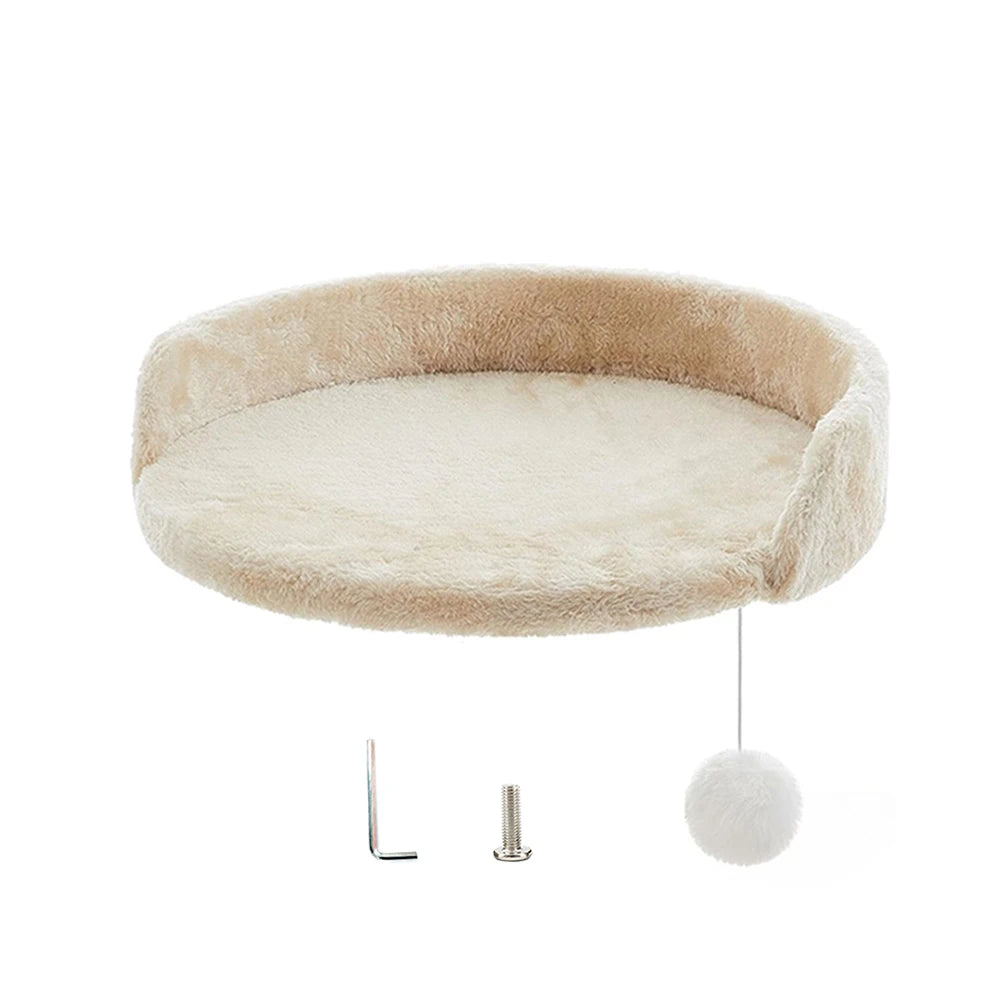 Round beige and white pet bed with a hanging ball on a white background