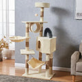 Cat tree with multiple levels, platforms, and a hammock in a room setting.