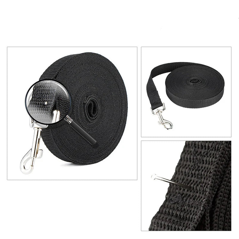 Black dog leash with metal clip on a white background