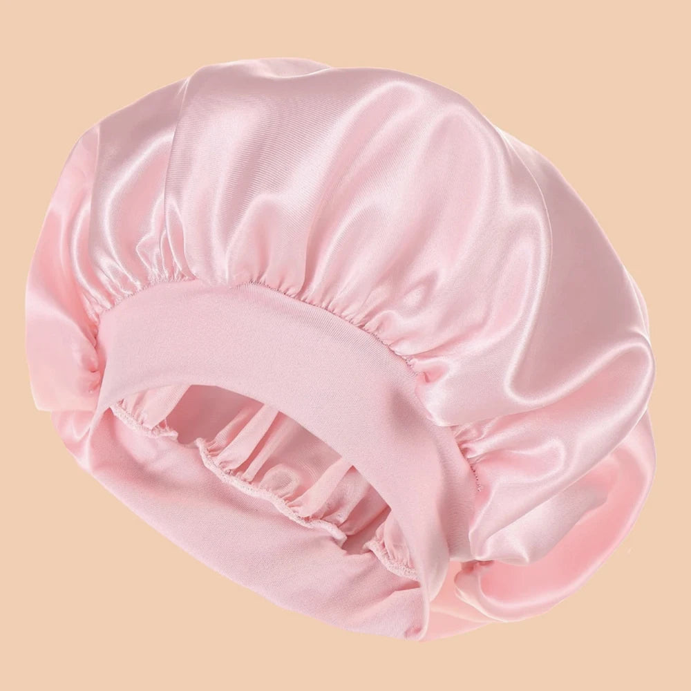 Pink satin bonnet on a beige background