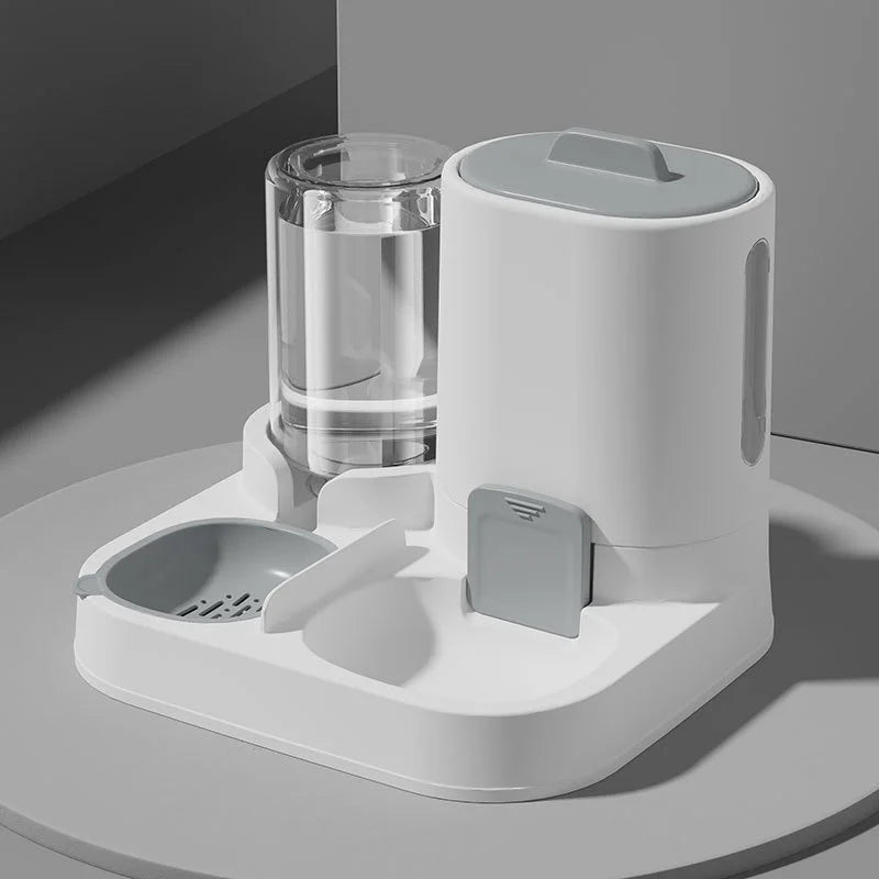 White pet feeder and water dispenser on a gray surface