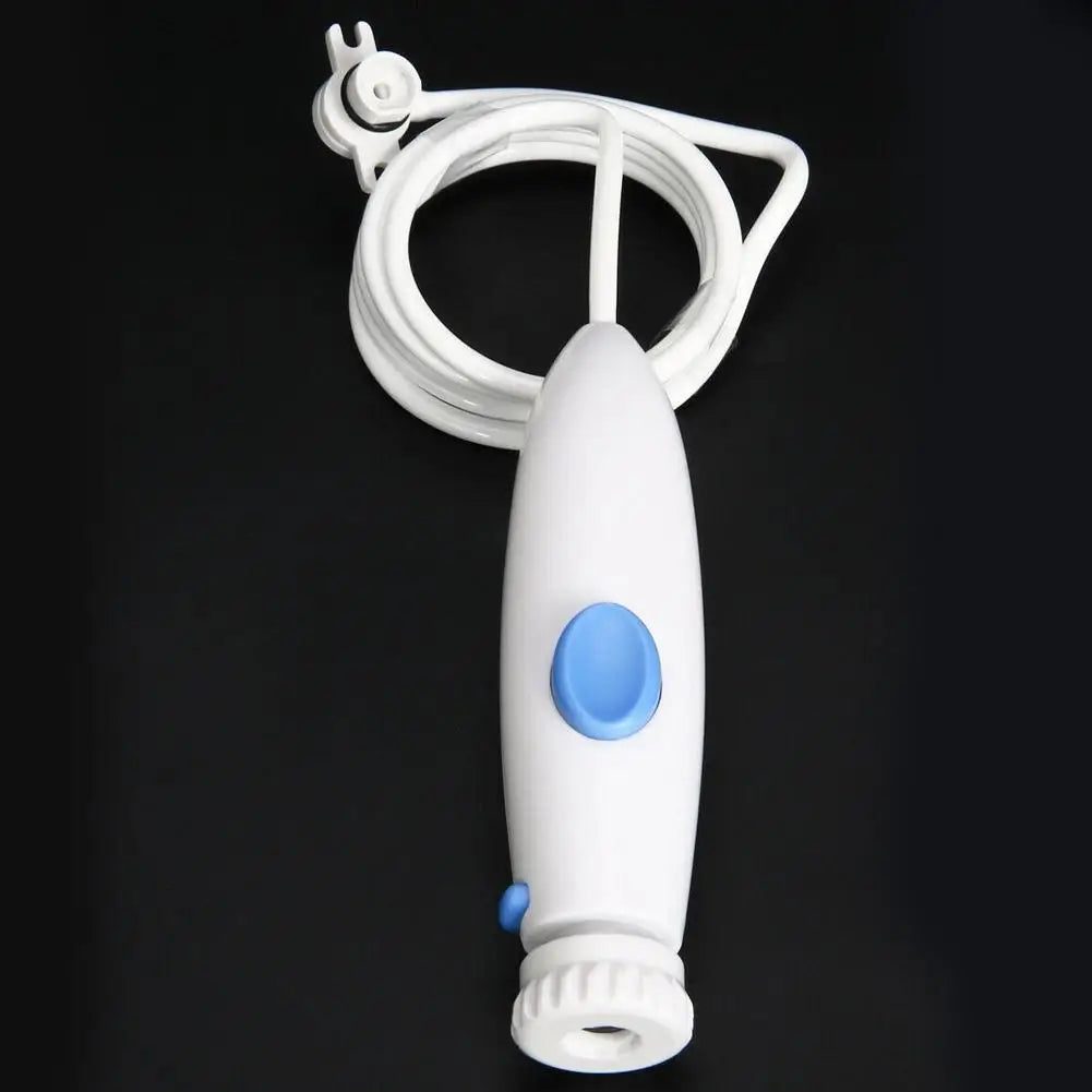 A white electric facial cleansing brush with a coiled cord and a blue power button, shown against a solid black background.