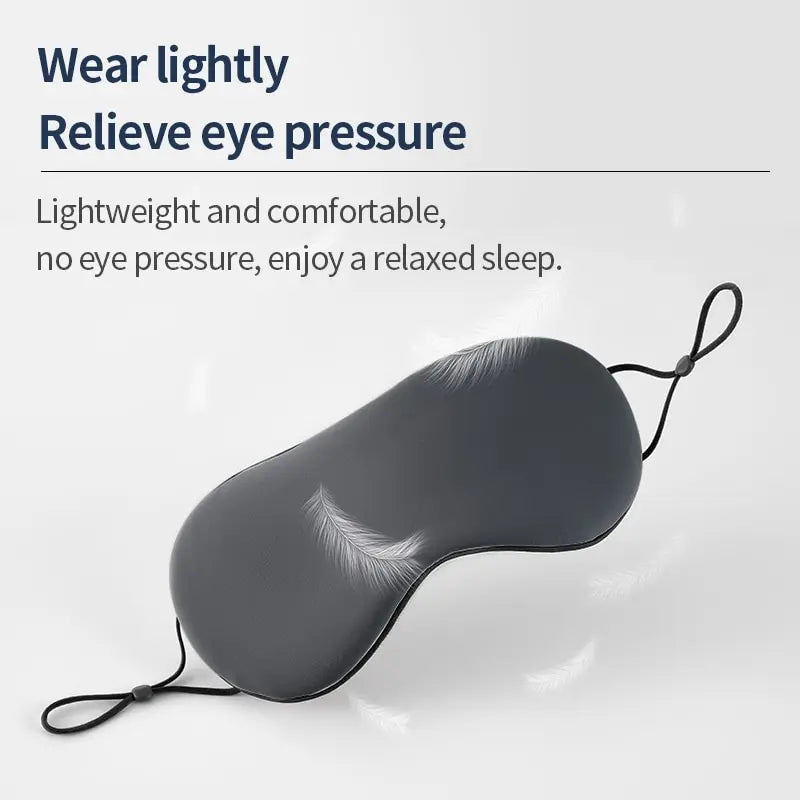 Gray sleep mask with feather details on a white background, featuring text about eye pressure relief.