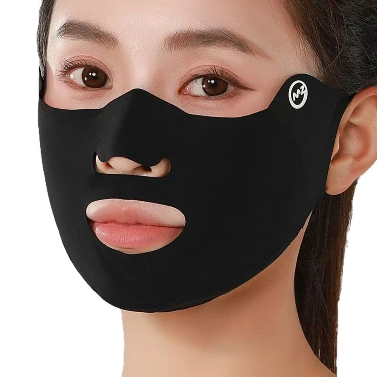Black face mask with cutouts for eyes, nose, and mouth worn by a person.