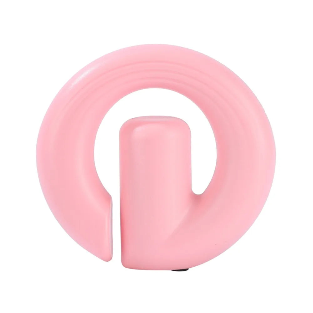 A light pink silicone safety ring designed for babies, toddlers, or pets, featuring a central cylindrical handle, shown on a solid white background.