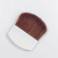 Makeup brush with brown bristles on a white background