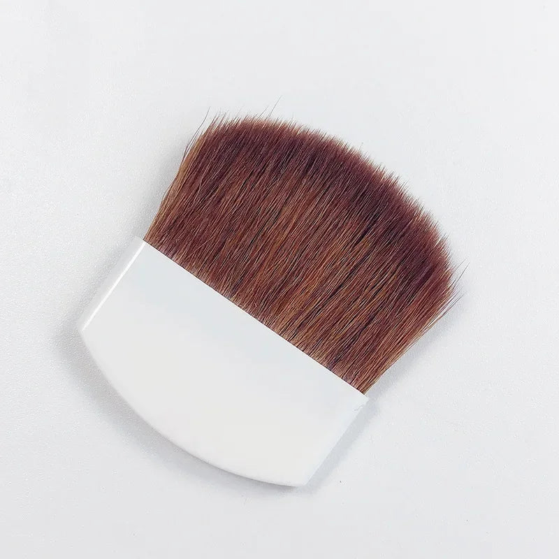 Makeup brush with brown bristles on a white background