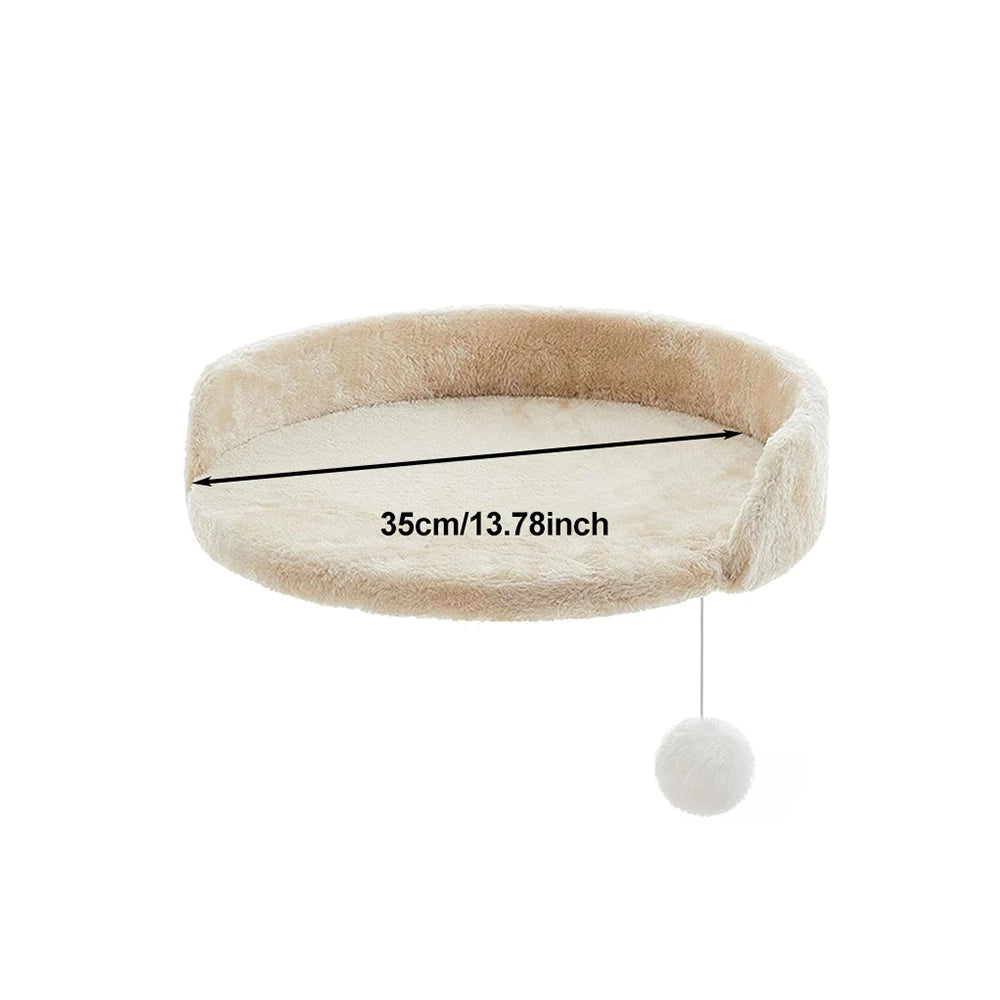 Beige pet bed with a hanging white ball on a white background