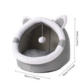 Gray pet bed with white accents and a hanging ball on a white background