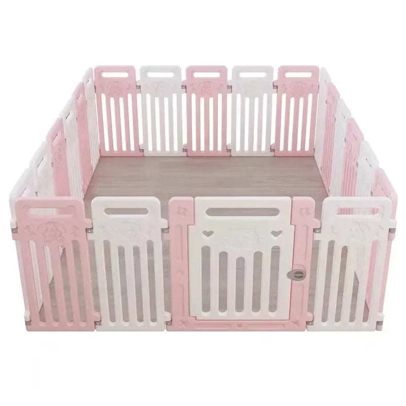 A pink and white plastic pet playpen with a wooden floor, shown on a solid white background.