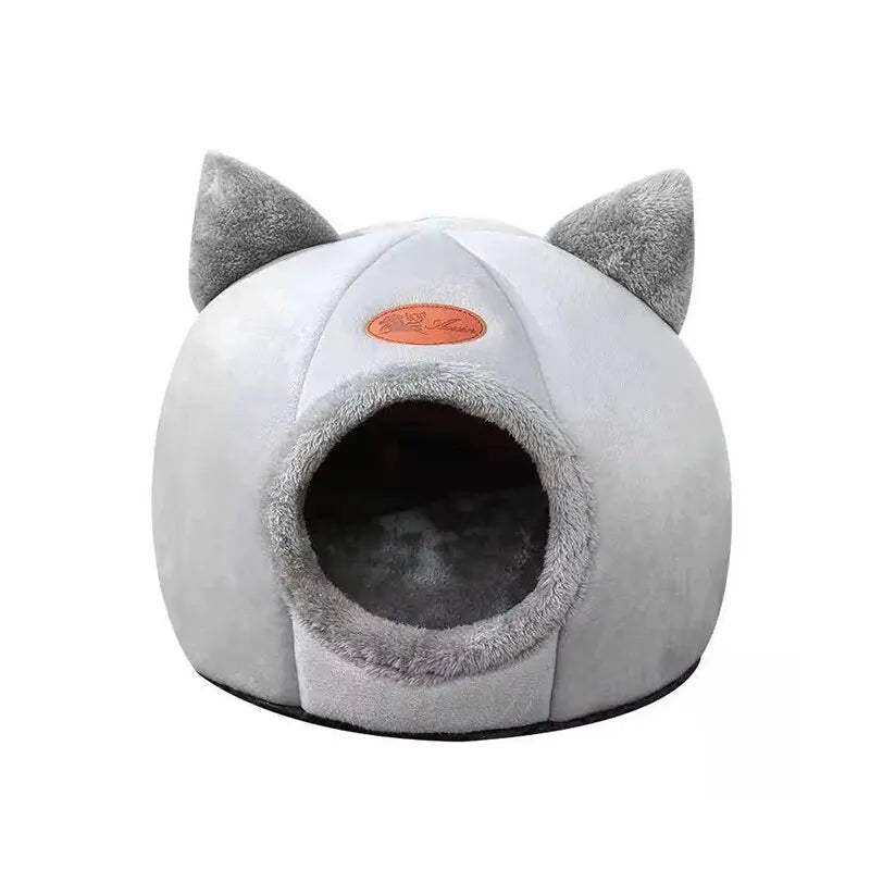 Gray pet bed with cat ears on a white background