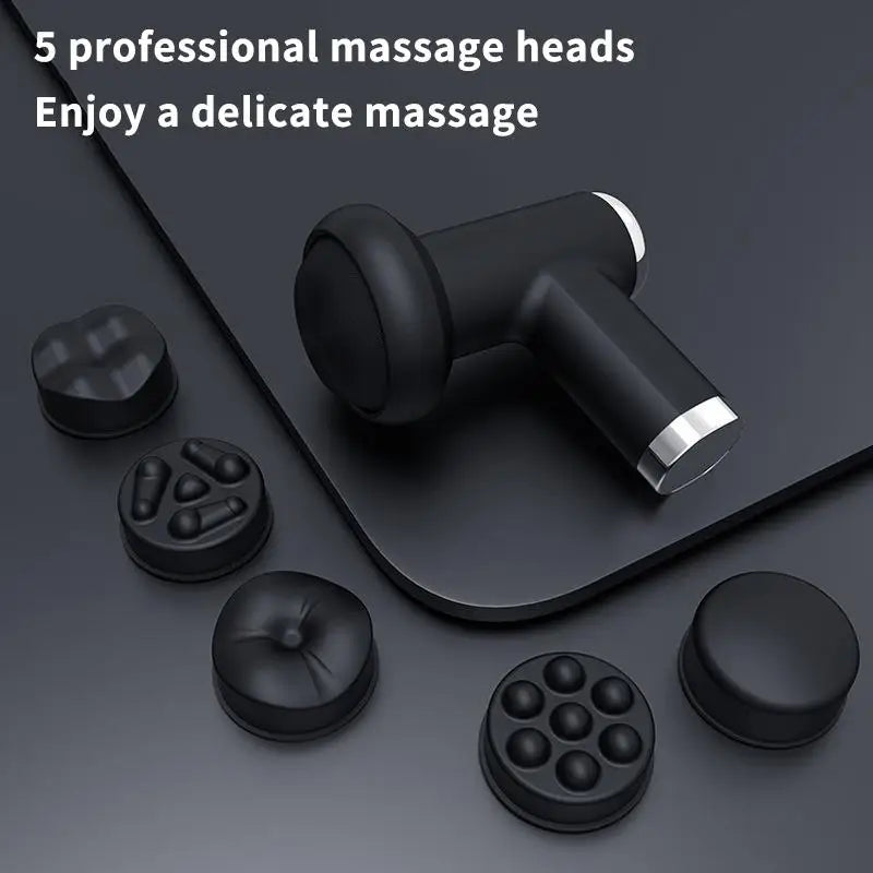 Black handheld massage gun with five interchangeable massage heads displayed on a dark gray surface, with promotional text reading '5 professional massage heads Enjoy a delicate massage'.