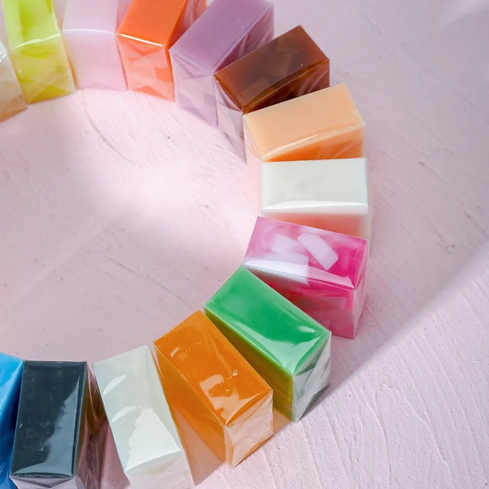 Colorful square blocks arranged in a circular pattern on a light pink surface.