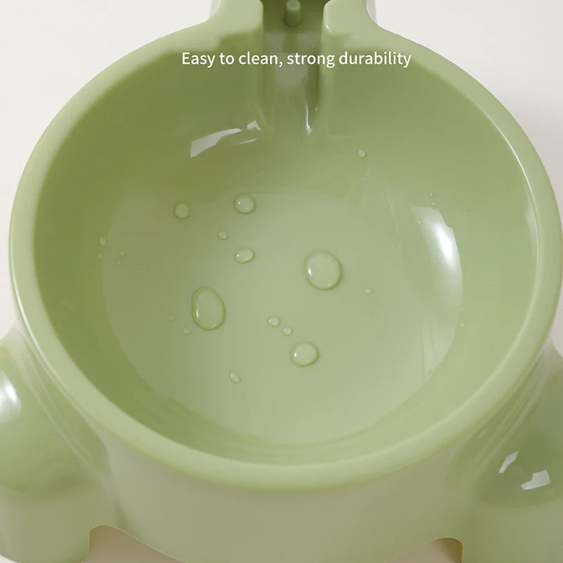 Green pet bowl with water droplets on a white background