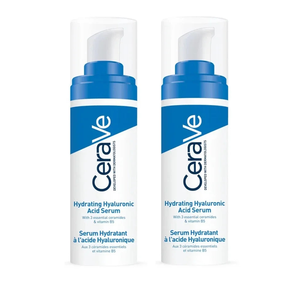 Two white pump bottles of CeraVe Hydrating Hyaluronic Acid Serum with blue accents, shown side by side on a white background.