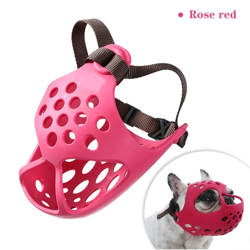 Pink dog muzzle with brown straps on a white background