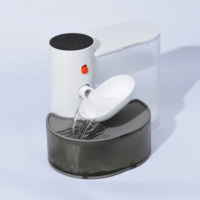 Pet water fountain with water flowing on a light gray background