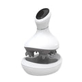 A white and gray electric head massage device with a matching charging base, shown on a plain white background. A 'FLANIQUE NEW ARRIVAL' promotional badge is in the top-left corner, and 'ELANIQUE.