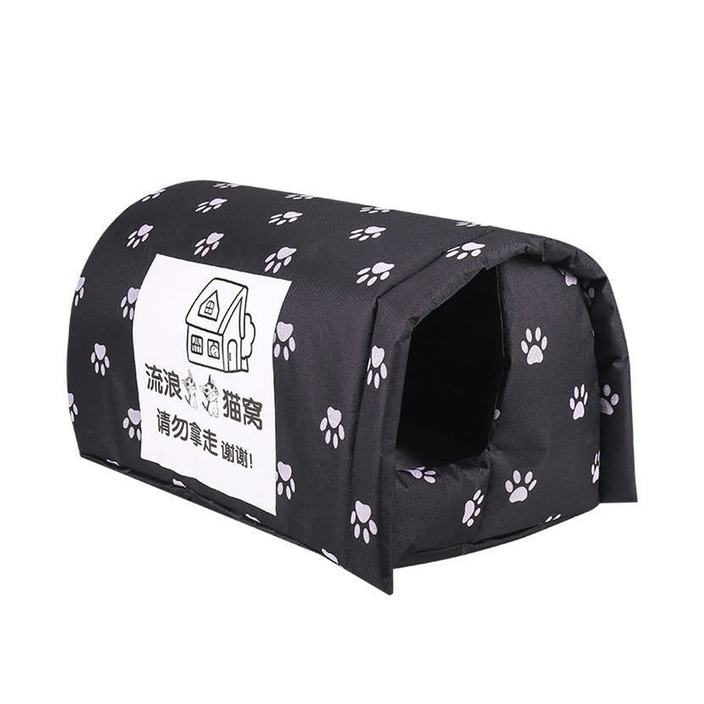 Black pet bed with white paw prints and a label on a white background