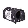 Black pet bed with white paw prints and a label on a white background