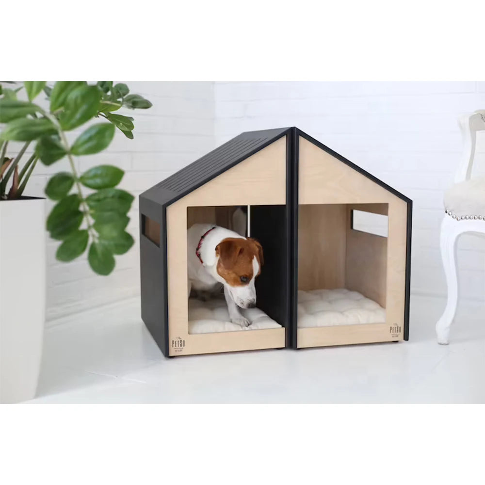 Dog inside a modern pet house with a plant and chair in the background