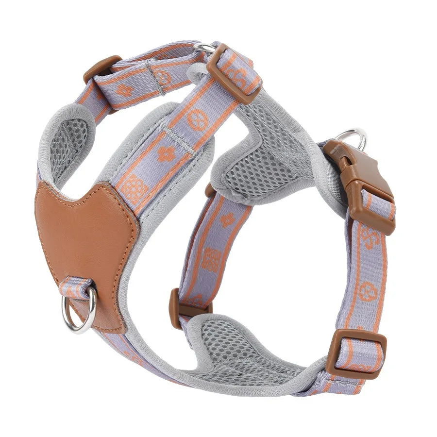 Dog harness with gray and orange pattern on a white background