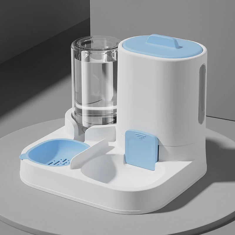 Pet water and food dispenser with a clear container on a gray surface