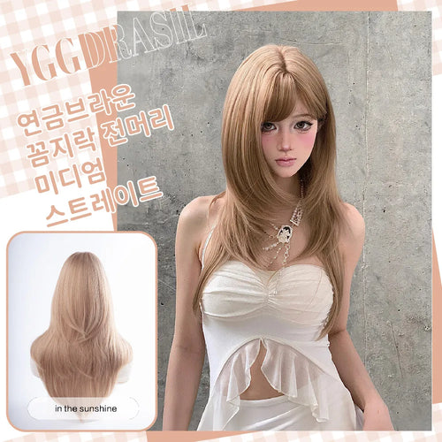 A model wearing a long, straight, light blonde wig with bangs, shown against a concrete wall with a smaller inset showing the back view of the wig in sunlight. Korean text overlays describe the wig's features, and 'YGGDRASILE' is watermarked at the top.