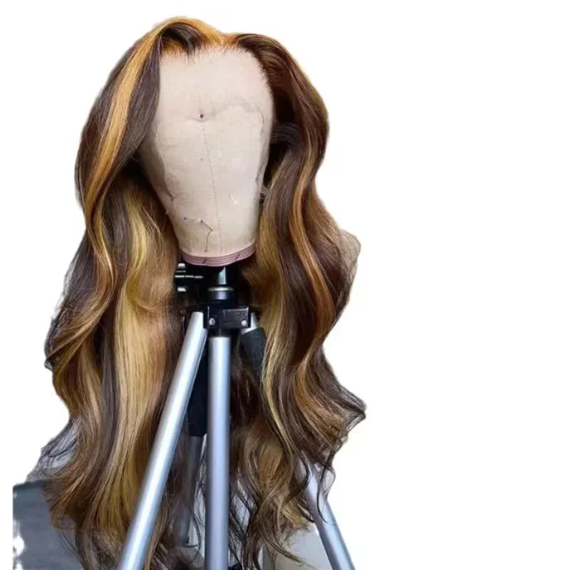 Mannequin head with a long, wavy brown wig on a white background