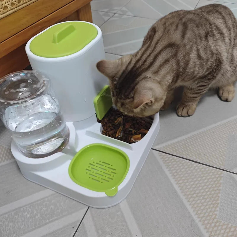 Cat interacting with a pet feeding station with water and food bowls on a tiled floor.
