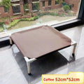 Coffee-colored pet bed on a tiled floor with a window view of a garden.