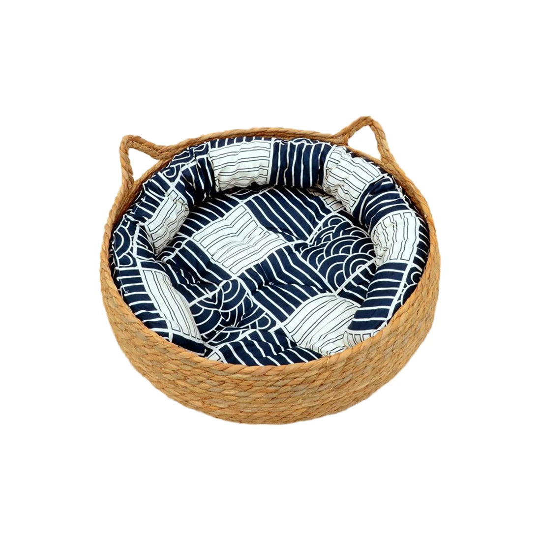 Woven pet bed with blue and white patterned cushion on a white background