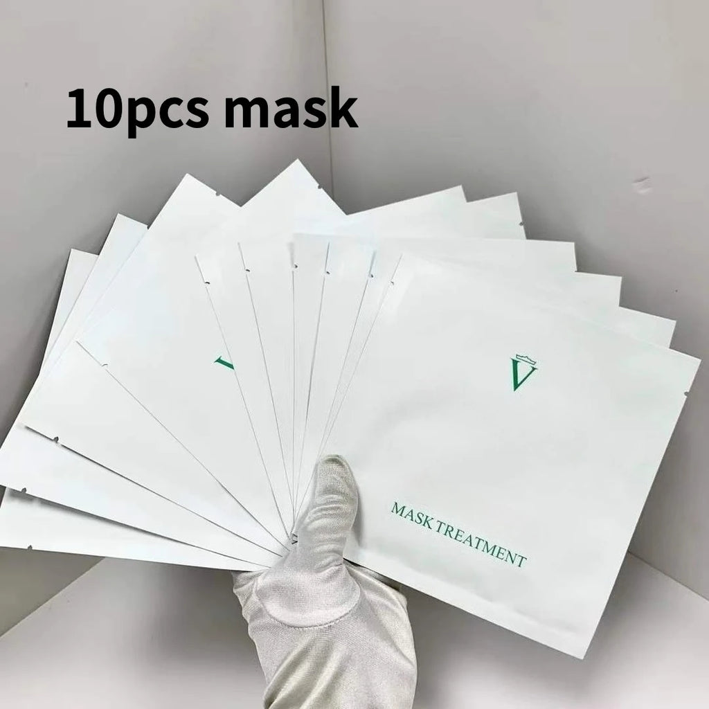 Packaging of 10 face masks with a gloved hand holding one, on a neutral background.