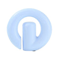 A light blue silicone baby teething ring with a central handle, shown on a plain white background.